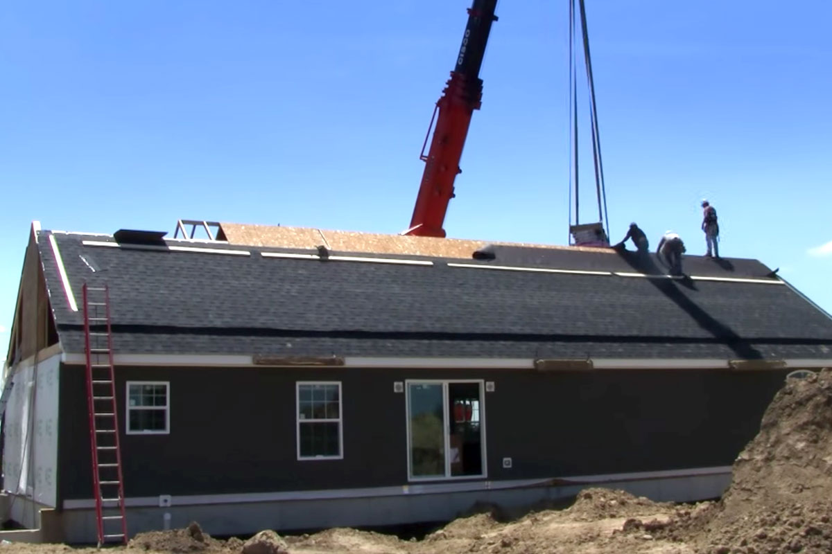 Watch time lapse video of a cape cod being set by Manorwood, one of our home builders